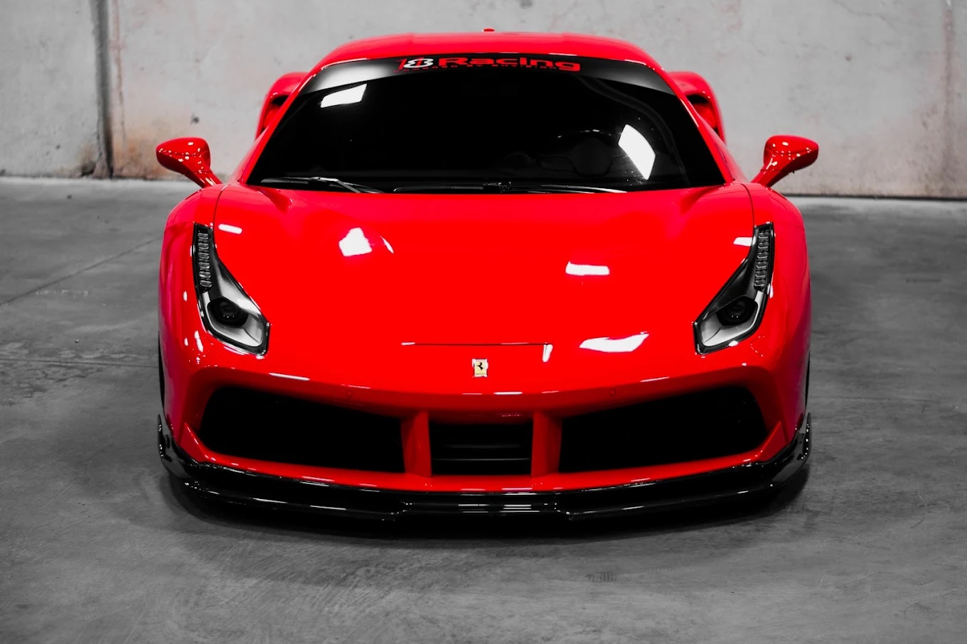 Red Ferrari 488 with paint polished to a deep gloss finish